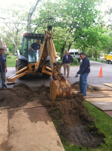 Trenching with backhoe